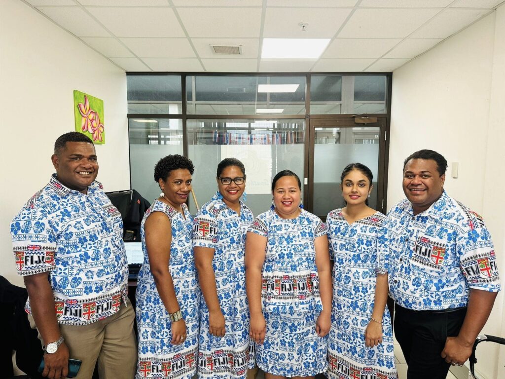 The Epic Transfers & Tours Fiji team with over 15 years of travel industry experience, standing proudly in front of their headquarters
